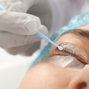 Young,Woman,Undergoing,Procedure,Of,Eyelashes,Lamination,In,Beauty,Salon,